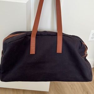 Blue Everlane canvas twill weekender bag